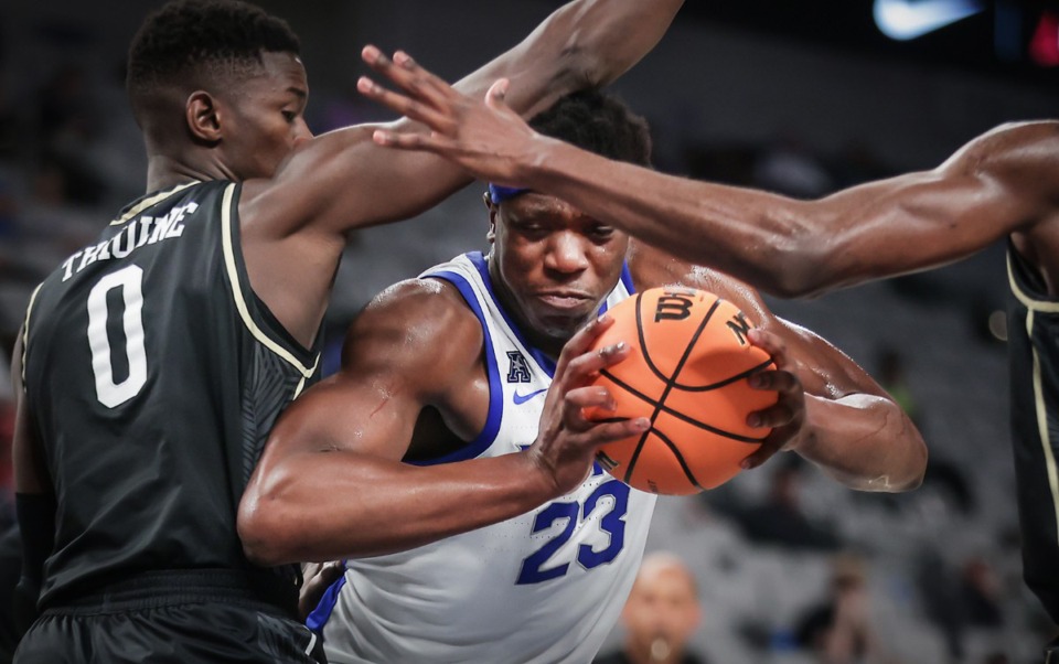 <strong>Memphis forward Malcolm Dandridge (23) fights for a layup during a March 10, 2023 game against UCF.</strong> (Patrick Lantrip/The Daily Memphian)