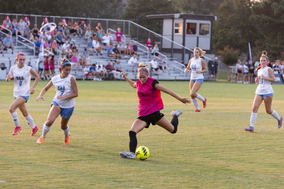 <strong>Houston&rsquo;s Lucy Smith (center) attempts a shot during the game against St. Agnes on Aug. 22, 2023. Houston won 8-0.</strong>&nbsp;(Brad Vest/Special to The Daily Memphian)