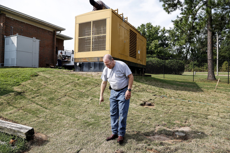 <strong>Bo Mills, director of public works, shows the path of leaked diesel fuel that seeped through the ground into water treatment plant pipe in Germantown during a tour Aug. 11.</strong> (Mark Weber/The Daily Memphian)