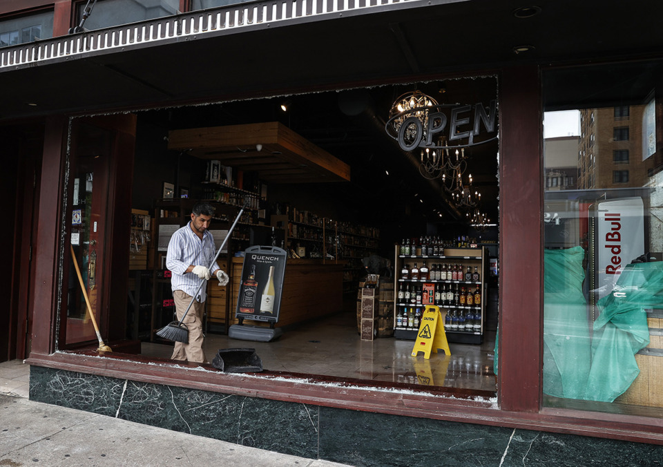 <strong>People clean up at Quench Wine and Sprits.</strong> (Mark Weber/The Daily Memphian file)