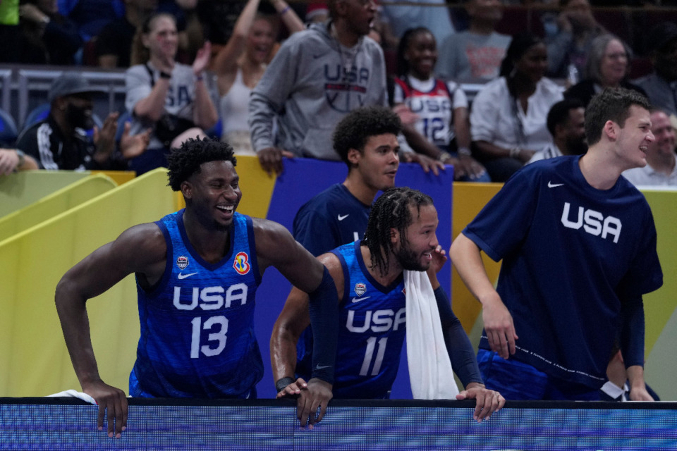 <strong>U.S. forward Jaren Jackson Jr. (13) and U.S. guard Jalen Brunson (11) reacts after U.S. forward Paolo Banchero (8) dunking during the Basketball World Cup quarterfinal game between Italy and U.S. at the Mall of Asia Arena in Manila, Philippines, Saturday, Aug. 31, 2023.</strong> (AP Photo/Michael Conroy)