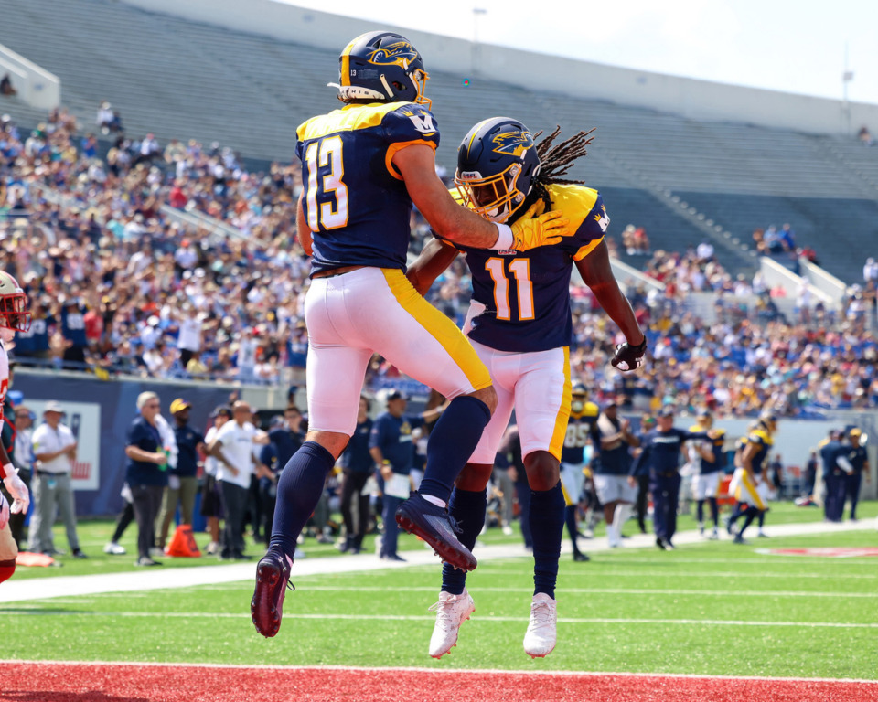 <strong>Memphis Showboats Vinny Papale (13) and Ezra Gray (11) celebrate after a touchdown during the Showboats game against the Birmingham Stallions June 17 at Simmons Bank Liberty Stadium.</strong> (Wes Hale/Special to The Daily Memphian)