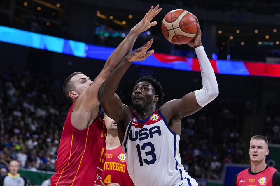 <strong>U.S. forward Jaren Jackson Jr. (13) shoots over Montenegro center Marko Simonovic (19) during the Basketball World Cup second round match in Manila, Philippines Friday, Sept. 1, 2023.</strong> (Michael Conroy/AP Photo)