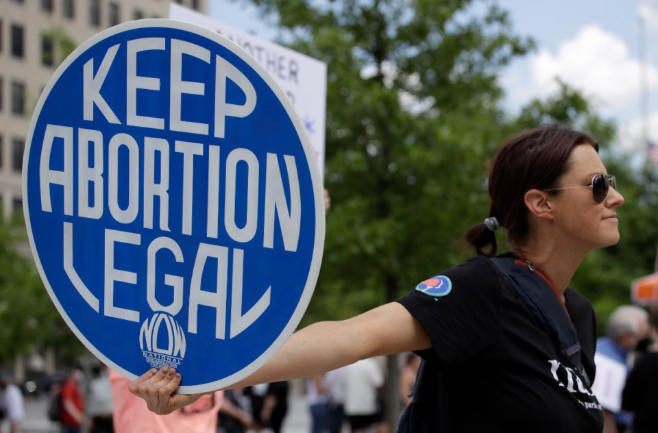 <strong>An Abortion rights demonstrator holds a sign during a rally on May 14, 2022, in Chattanooga. Women in Idaho, Tennessee and Oklahoma are challenging strict abortion laws.</strong> (Ben Margot/AP file)