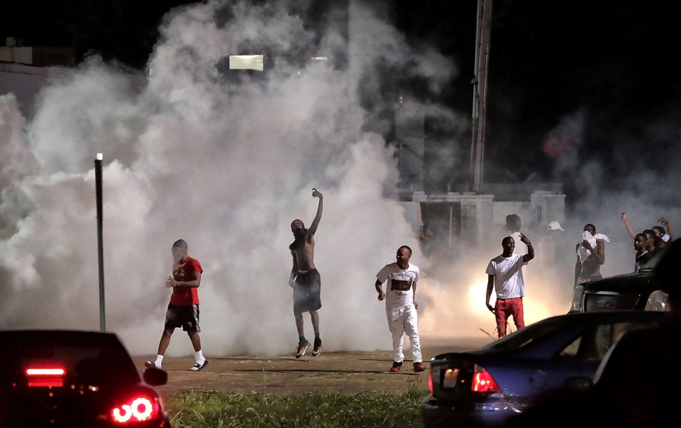 <strong>Angry residents taunt law enforcement as protesters take to the streets in the wake of the shooting of a youth identified by family members as Brandon Webber by U.S. Marshals earlier Wednesday.&nbsp;</strong><span class="s1"><strong>Dozens of protesters clashed with police, throwing stones and tree limbs until police forces broke up the angry crowd with tear gas.</strong> (Jim Weber/Daily Memphian)</span>