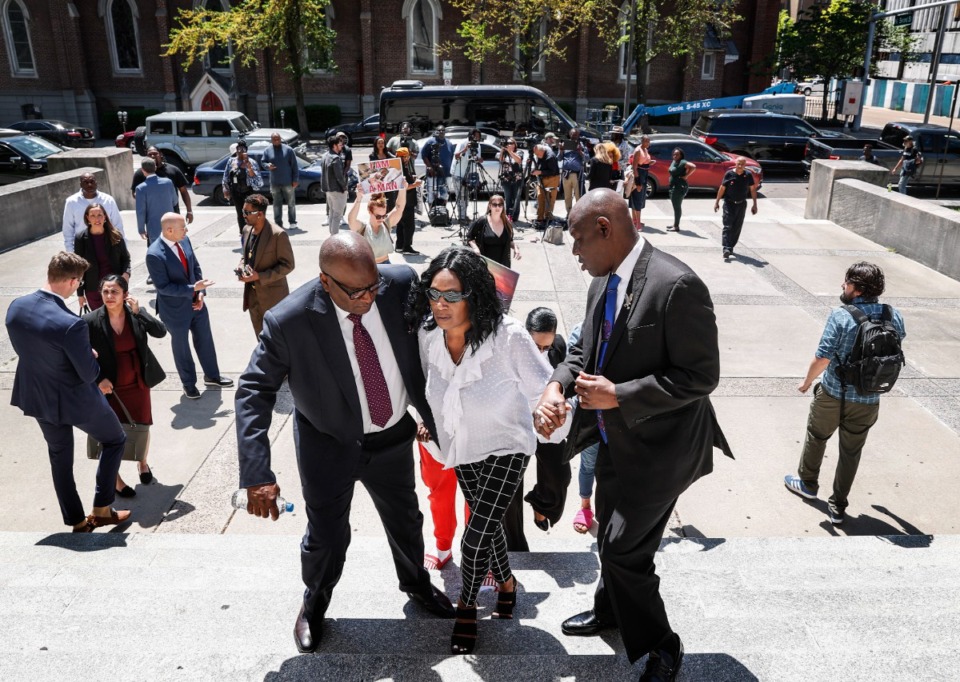 <strong>RowVaughn Wells, (middle) mother of Tyre Nichols, was helped up courthouse steps on Wednesday, April 19, 2023, after announcing a $550 million civil lawsuit against the City of Memphis, Memphis Police Department, and individual officers for the January 2023 death of her son.</strong> (Mark Weber/The Daily Memphian file)