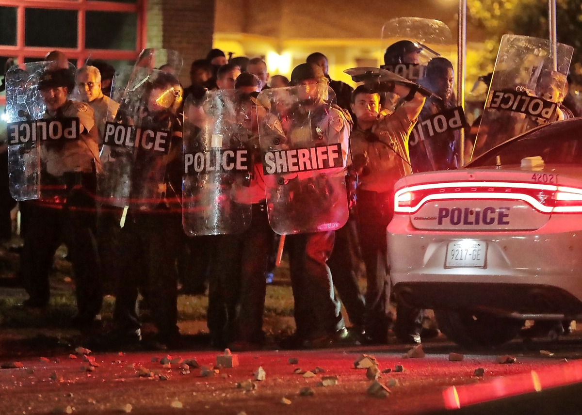 <strong>Shelby County Sheriff's Department deputies brace against the crowd as protesters take to the streets of Frayser in anger against the shooting of a youth identified by family members as Brandon Webber by U.S. Marshals earlier Wednesday evening.&nbsp;</strong><span class="s1"><strong>Dozens of protesters clashed with police, throwing stones and tree limbs until police forces broke up the angry crowd with tear gas. </strong>(Jim Weber/Daily Memphian)</span>
