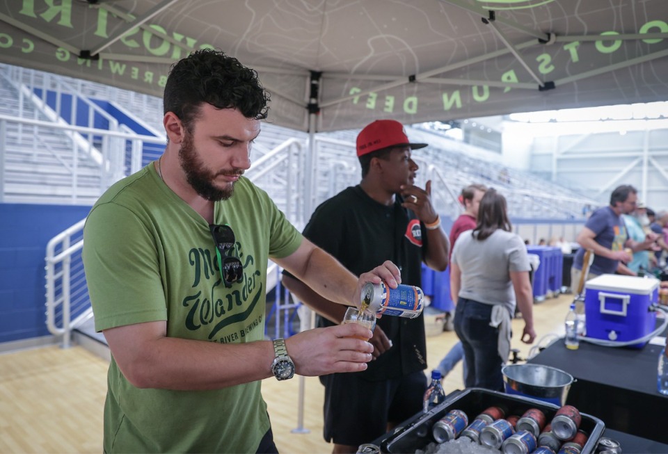 <strong>Kyle Sklar pours a beer Saturday, Sept. 16 at the 12th annual Memphis Brewfest held at the Memphis Sports and Events Center.</strong> (Patrick Lantrip/The Daily Memphian)
