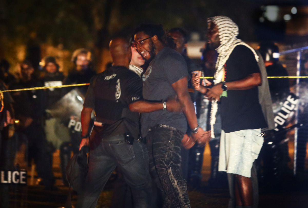<strong>Protesters take to the streets of Frayser in anger against the shooting of a youth identified by family members as Brandon Webber by U.S. Marshals earlier in the evening. Dozens of protesters clashed with police, throwing stones and tree limbs until police forces broke up the angry crowd with tear gas.</strong> (Mark Weber/Daily Memphian)