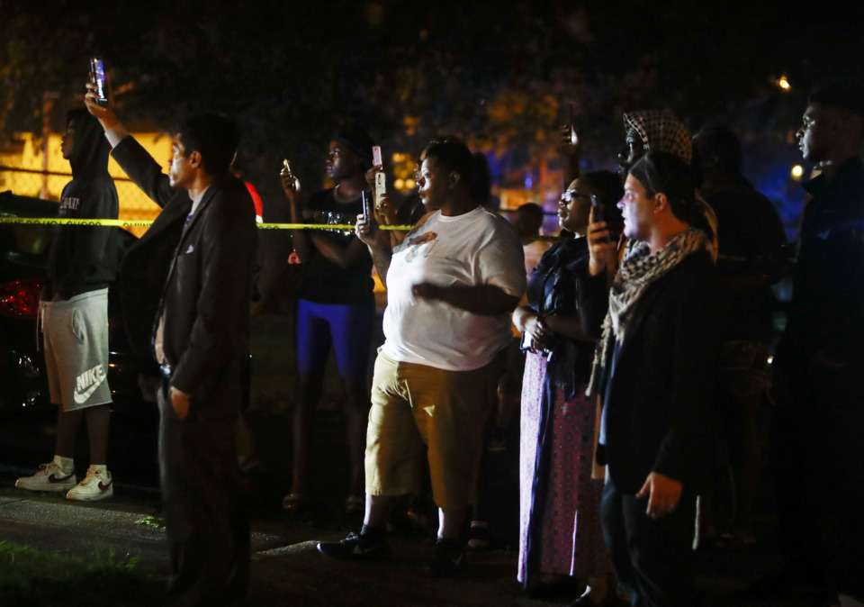 <strong>Protesters take to the streets of Frayser in anger over the shooting of a youth by U.S. Marshals earlier Wednesday. Dozens of protesters clashed with law enforcement, throwing stones and tree limbs until police broke up the angry crowd with tear gas.</strong> (Mark Weber/Daily Memphian)
