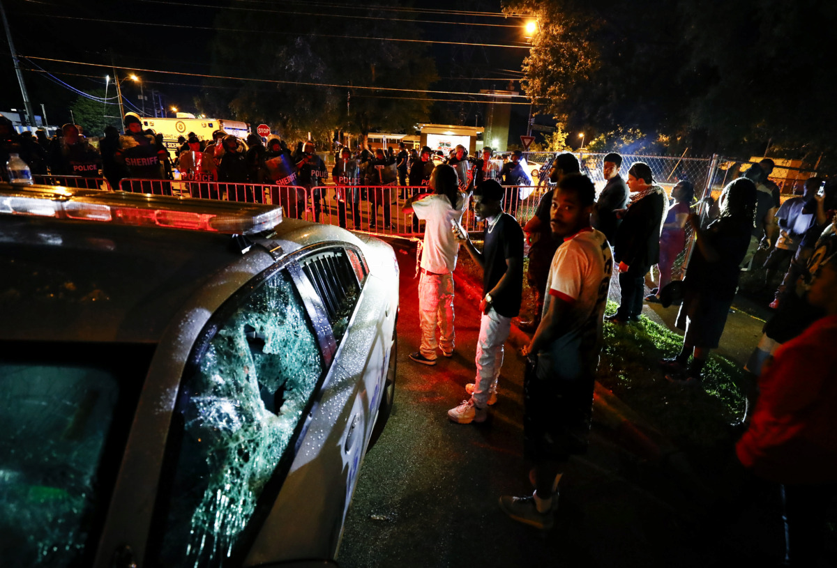 <strong>Protesters take to the streets of Frayser in anger against the shooting a youth by U.S. Marshals earlier Wednesday. Dozens of protesters clashed with law enforcement officials, throwing stones and tree limbs until police broke up the angry crowd with tear gas.</strong> (Mark Weber/Daily Memphian)
