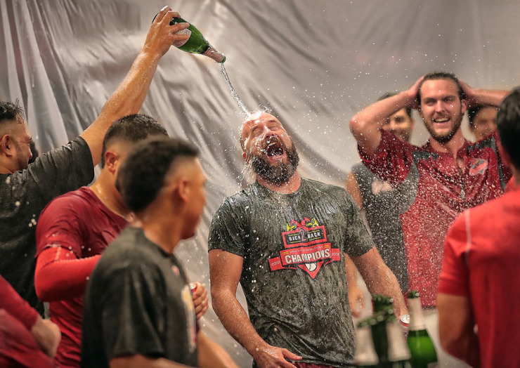 <strong>The Redbirds douse Lance Thompson with champagne in the the locker room after scoring three runs in the bottom of the 10th inning to beat the Oklahoma City Dodgers Sept. 9, 2018, and clinch a spot in the Pacific Coast League finals.</strong> (The Daily Memphian file)