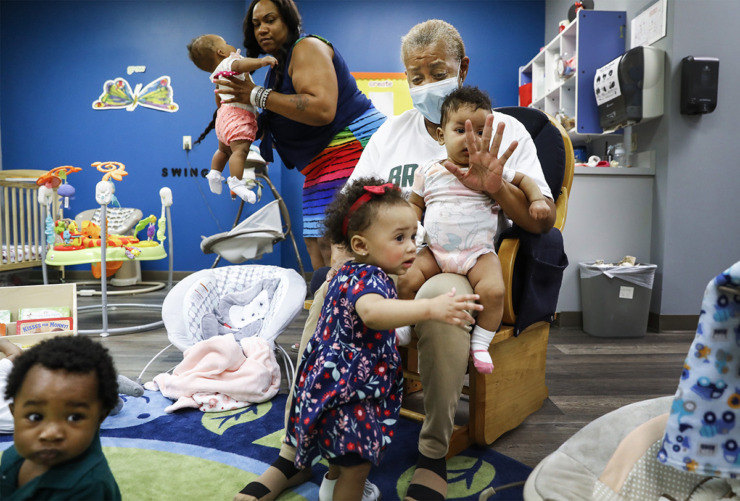<strong>Brown Christian Academy infant room teacher Jennifer Dennis (middle) takes care of newborns and babies on May 28, 2021, in Southaven.</strong> (Mark Weber/The Daily Memphian file)