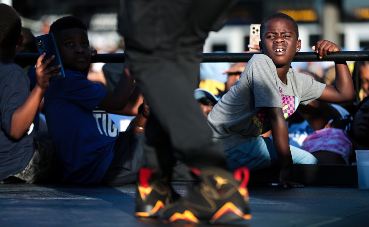 <strong>A young Memphian watches a jookin' contest during The 901 Day Grizz Bash held outside of FedExForum Sept. 1, 2022.</strong> (The Daily Memphian file)