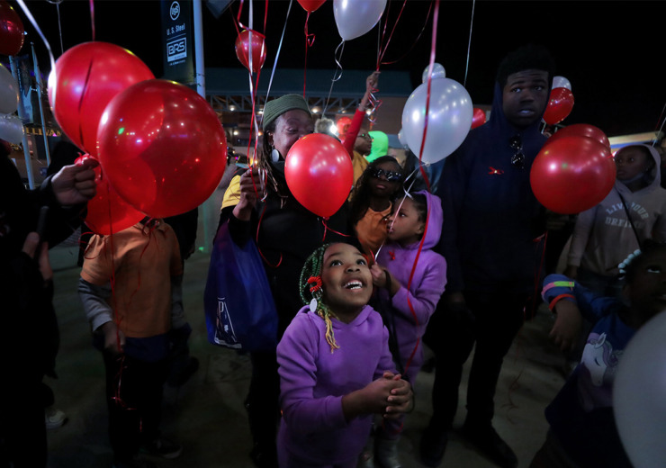 <strong>Jaliyah Williams laughs in anticipation of the balloon release at the Shelby County Health Department's annual World AIDS Day event at FedExForum Dec. 1, 2022.</strong> (The Daily Memphian file)