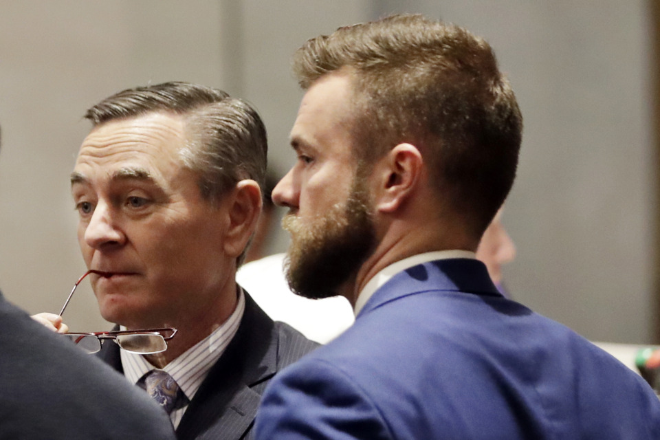 <strong>House Speaker Glen Casada, left, talks with then-chief of staff Cade Cothren on May 2, 2019. Cothren has resigned and Casada plans to leave the speaker's post Aug. 2 amid upheaval over sexist and racist text messages.&nbsp;</strong>(AP Photo/Mark Humphrey, File)