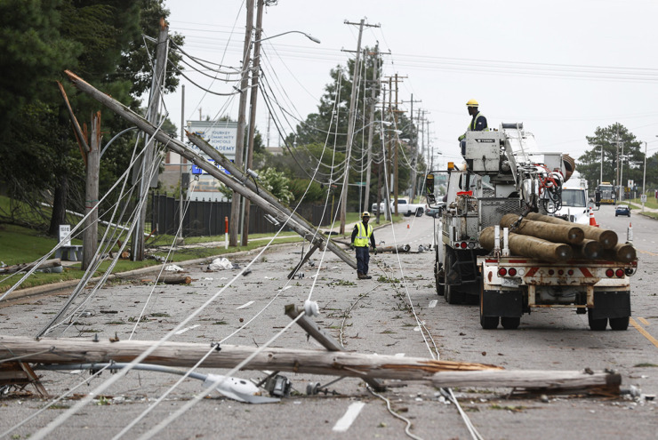 <strong>Memphis Light, Gas and Water crews work to restore power to several downed electrical lines on Winchester Avenue near Ross Road on Wednesday, July 19, 2023, after a storm caused outages affecting just shy of 140,000 customers. It was the eighth-worst storm on record for MLGW, in terms of outages.&nbsp;</strong>(Mark Weber/The Daily Memphian file)