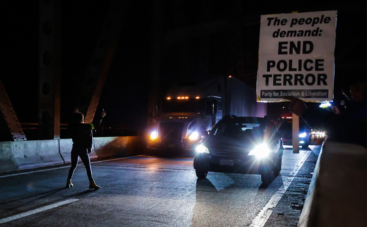 <strong>A protester tries to stop oncoming interstate traffic on the I-55 bridge Jan. 27, 2023, after departing from a protest demanding justice for Tyre Nichols. Nichols was killed by Memphis Police officers on Jan. 7.</strong> (Patrick Lantrip/The Daily Memphian file)