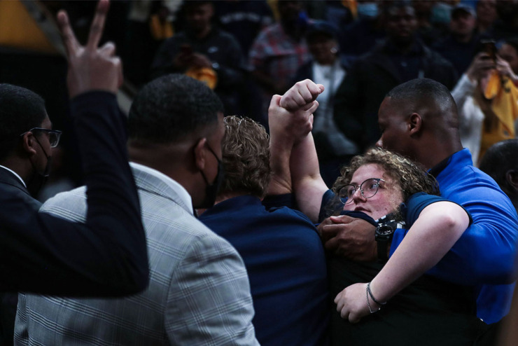 <strong>Animal rights activist Zoe Rosenberg is carried off by FedExForum security after attempting to chain herself to the basket stanchion during an NBA playoff game between the Minnesota Timberwolves and Memphis Grizzlies at FedExForum Apr. 16, 2022. Rosenberg, 19, was arrested during an attempt to protest Timberwolves' owner Glen Taylor's treatment of chickens at his Iowa egg farm.</strong> (Patrick Lantrip/The Daily Memphian file)