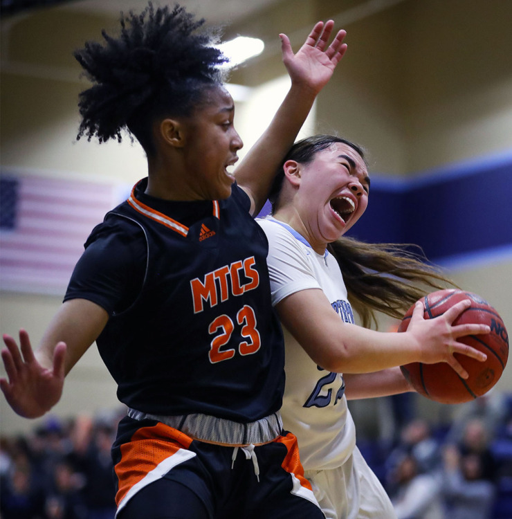 <strong>Northpoint Christian School guard Isabella Carlson (22) drives in for a lay-up against Middle Tennessee Christian School forward Jailyn Banks (23) on Feb. 25, 2022.</strong> (Patrick Lantrip/The Daily Memphian file)