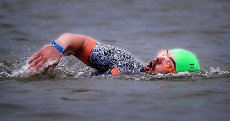 <strong>A swimmer competes in the first leg of the St.Jude IRONMAN 70.3 Memphis race at Shelby Farms on Oct. 2, 2021.</strong> (Patrick Lantrip/The Daily Memphian file)