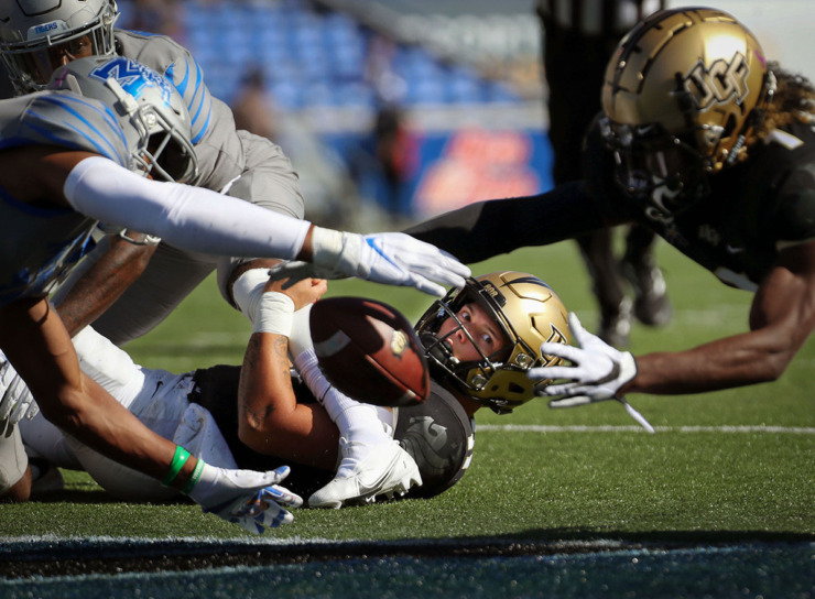 <strong>University of Central Florida quarterback Dillon Gabriel (11) watches a teammate fight for a loose ball during the Oct. 17, 2020, game against the University of Memphis at Liberty Bowl Memorial Stadium.</strong> (Patrick Lantrip/The Daily Memphian file)