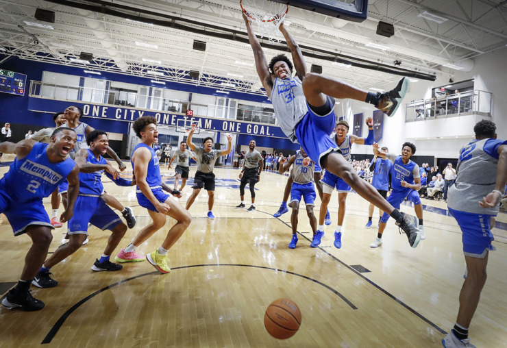 <strong>University of Memphis center James Wiseman (middle) dunks as his teammates celebrate during an open practice in front of the Rebounders Club at the Laurie-Walton Family Basketball Center on Tuesday, Sept. 24, 2019.</strong> (Mark Weber/The Daily Memphian file)