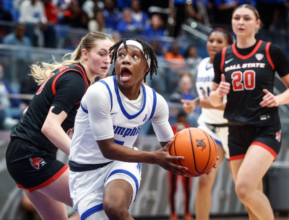<strong>University of Memphis Tigers guard Emani Jefferson (front) drives during a WNIT game in March.</strong> (Mark Weber/The Daily Memphian file)