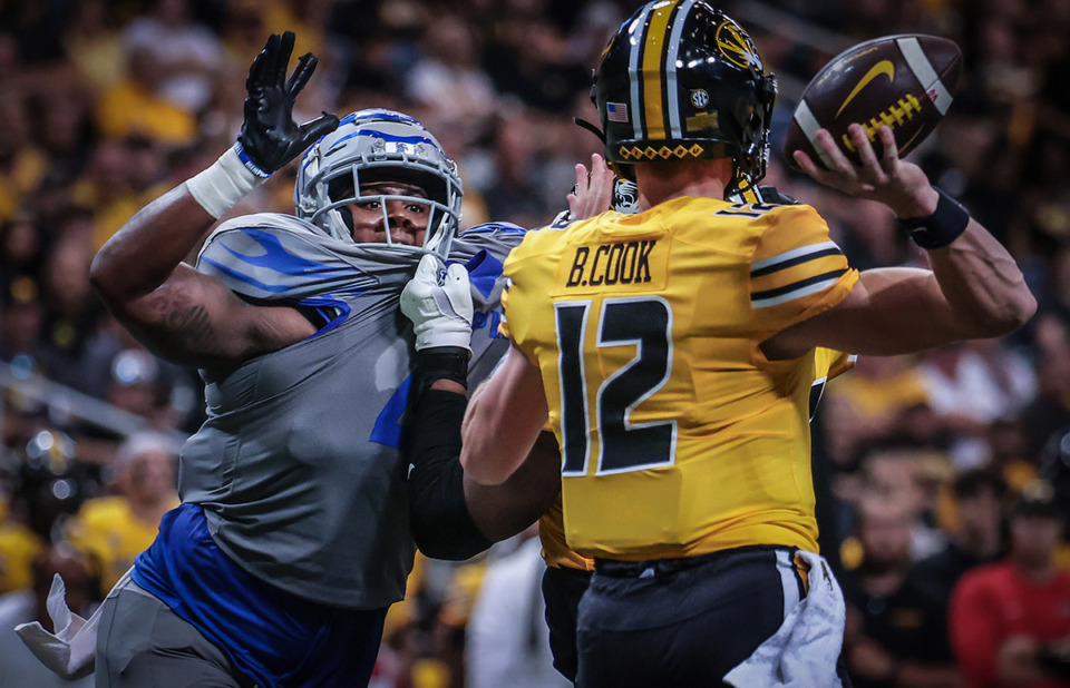 <strong>University of Memphis lineman Josh Ellison (4) rushes the quarterback during a Sept. 23 game against the University of Missouri in St. Louis.</strong> (Patrick Lantrip/The Daily Memphian)