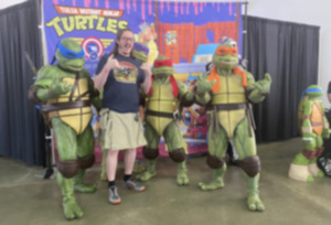 <strong>Ninja Turtles fan Seth Livengood poses with the Tulsa Mutant Ninja Turtles charity group from Oklahoma Sept. 23.</strong> (Michael Waddell/Special to The Daily Memphian)