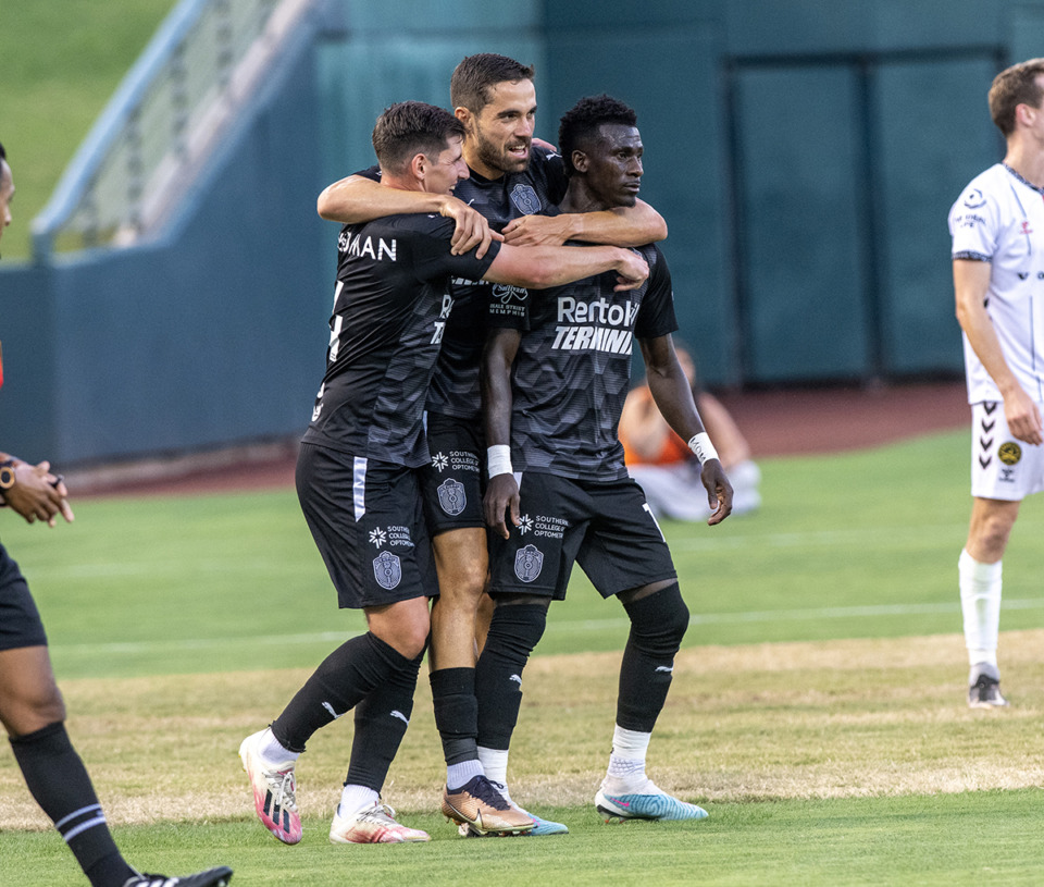 <strong>Memphis 901 FC's Henderson Hyndman and Rodrigo da Costa grab teamate Laurent Kissiedou after he scores in the first period of a match against Charleston at AutoZone Park.</strong> (Greg Campbell/Special to The Daily Memphian)