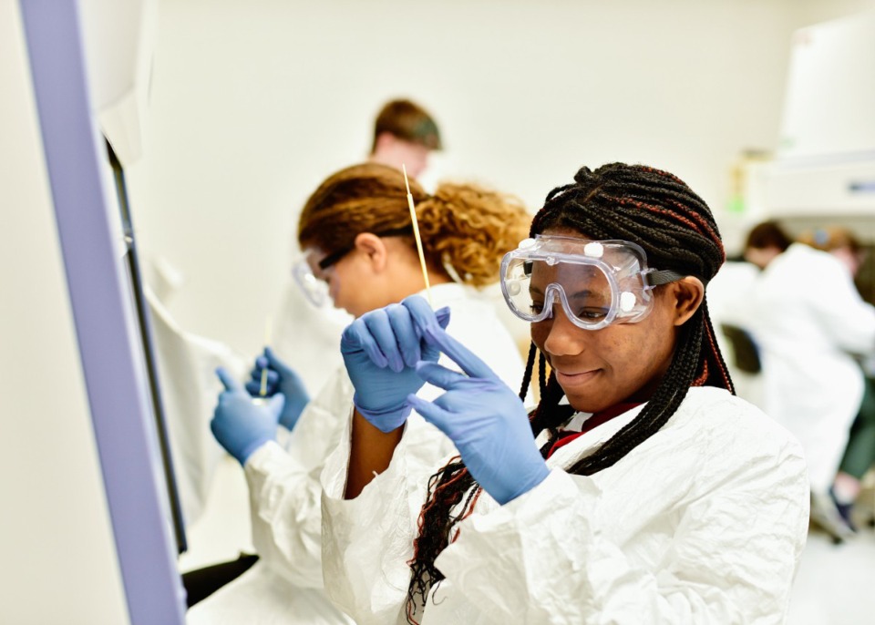 <strong>Ihinosen Ireudo, a freshman at Lakeland Prepatory School, studies microrganisms in the school's new Bio-STEM "clean room."</strong> (Houston Cofield/Special To The Daily Memphian)
