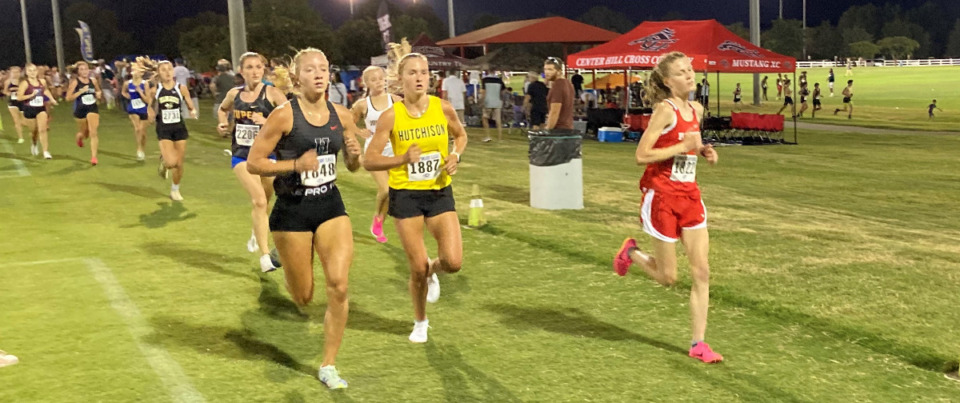 <strong>Houston senior Zoe Marsh (left) and Hutchison senior Meriel Rowland (center), in a photo from this year&rsquo;s City Auto Memphis Twilight Classic, have the top two female cross country times this season.</strong> (David Boyd/The Daily Memphian)