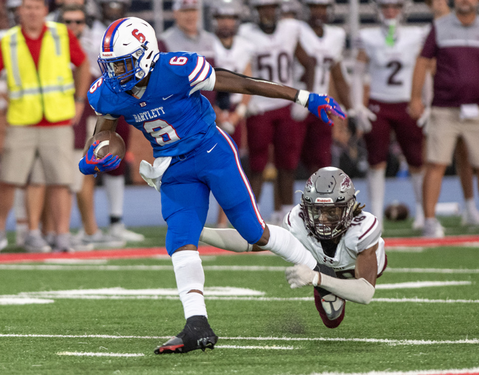 <strong>Bartlett running back Geron Johnson pulls loose from Collierville's cornerback Kyle Campbell on Sept. 1.&nbsp;The AP ranks Bartlett No. 7 in Division 1-Class 6A this week.</strong> (Greg Campbell/The Daily Memphian file)
