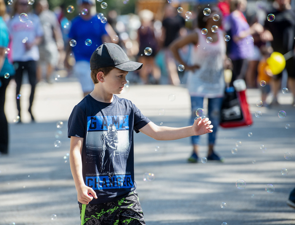 <strong>Jordan Marks-Gow pauses to capture a few bubbles at the Bartlett Festival Saturday, Sept. 28, 2019, at W. J. Freeman Park in Bartlett.</strong> (Greg Campbell/Special to The Daily Memphian)