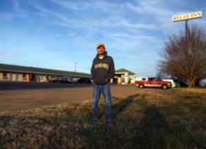 <strong>Relax Inn owner Mike Patel stands in a vacant field next to his motel in Lakeland Dec. 18, 2020.</strong> (Patrick Lantrip/The Daily Memphian file)