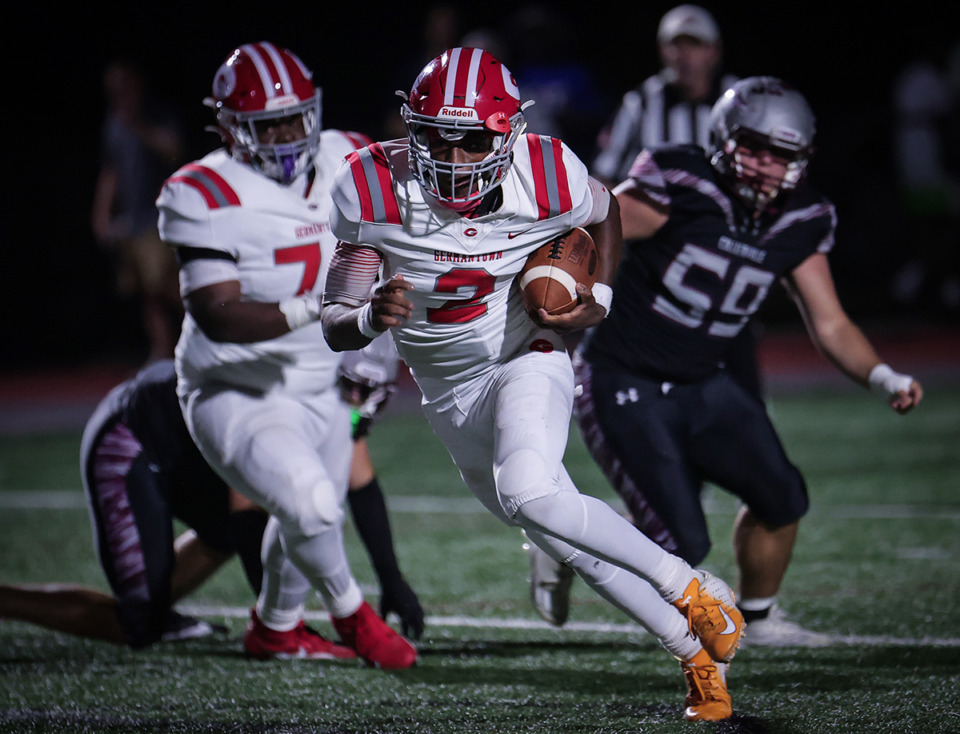 <strong>Germantown quarterback Cordero Walker (2) runs past several defenders during a Sept. 22 game against Collierville.</strong> (Patrick Lantrip/The Daily Memphian)