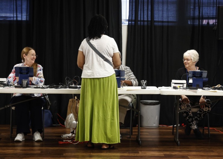<strong>Poll workers help voters during early voting at Raleigh United Methodist Church Sept. 18.</strong> (Mark Weber/The Daily Memphian)