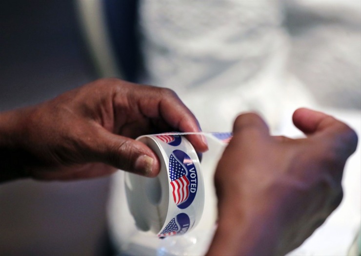 <strong>A poll worker tears off an &ldquo;I voted&rdquo; sticker at Faith Presbyterian Church in Germantown during the primary election Aug. 6, 2020</strong>. (Patrick Lantrip/The Daily Memphian file)