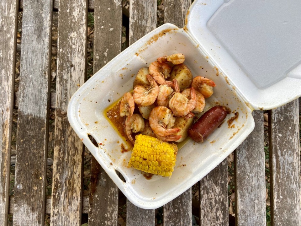 <strong>Straight Drop Seafood has 3/8 lb. of shrimp, four potato wedges, half a corn on the cob and half a sausage for $10.</strong> (Joshua Carlucci/The Daily Memphian)