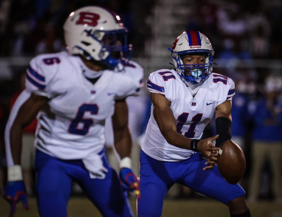<strong>Bartlett quarterback Kam Alexander (11) tries to wrangle a bad snap during the Oct. 6, 2023, game against Germantown.</strong> (Patrick Lantrip/The Daily Memphian)