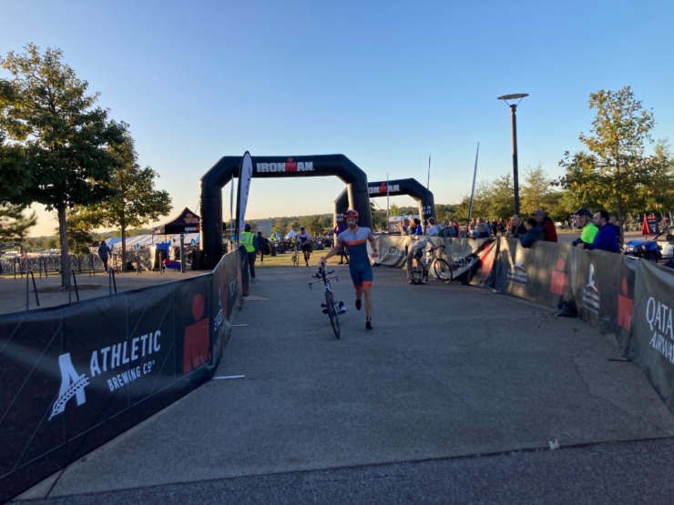 <strong>A triathlete heads out of the transition area to begin the 56-mile portion of the 70.3 Ironman race that took cyclists on roads in Shelby and Fayette counties before returning to Shelby Farms Park.&nbsp;</strong> (David Boyd/The Daily Memphian)