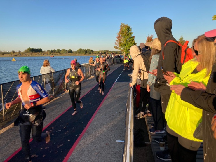 <strong>Triathletes who completed the 1.2 mile swim ran nearly a quarter mile to the transition area before beginning the 56-mile bike portion of the Ironman, Saturday, Oct. 7, 2023 at Shelby Farms.</strong> (David Boyd/The Daily Memphian)