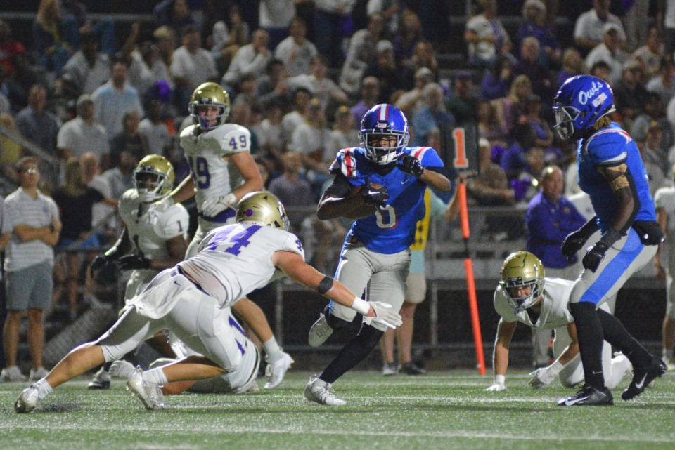 <strong>Brandon Nicholson of MUS breaks tackles en route to the end zone in the game against CBHS on Friday, Oct. 13, 2023.</strong> (Joshua White/Special to The Daily Memphian)