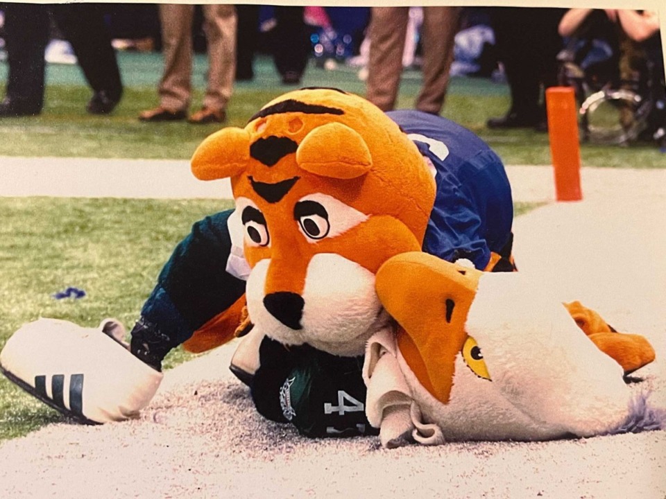 <strong>Pouncer tackles the North Texas mascot at the New Orleans Bowl in 2003.</strong> (Courtesy Chris Kourvelas)