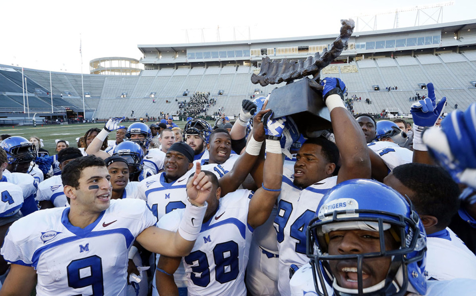 <strong>Memphis players celebrate with the Bones trophy after defeating UAB 46-9 in their annual Battle for the Bones NCAA college football game at Legion Field in Birmingham, Ala., Nov. 17, 2012.</strong> (Hal Yeager/AP Photo file)