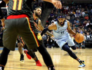 <strong>Mike Conley drives to the basket during a 2018 Grizzlies game against the Atlanta Hawks at FedExForum in Memphis. The Grizzlies traded Conley to the Utah Jazz on Wednesday, June 19, ending one era but bolstering the new one.</strong> (Daily Memphian file)