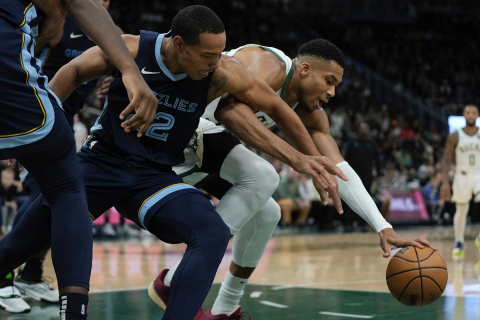 <strong>Memphis Grizzlies' Desmond Bane and Milwaukee Bucks' Giannis Antetokounmpo go after a loose ball on Friday, Oct. 20, 2023, in Milwaukee.</strong> (Morry Gash/AP)