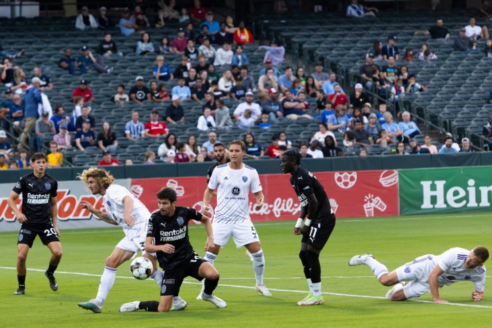 <strong>901 FC players work to get to the ball during Saturday's 901 FC home playoff game vs. Louisville at AutoZone Park.</strong>(Brad Vest/Special to The Daily Memphian)