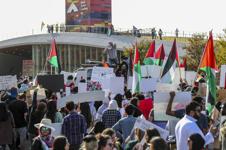 <strong>Demonstrators hold signs and wave Palestinian flags during a rally in support of Gaza and Palestine as they march to Beale Street Landing on Sunday, October 22, 2023.</strong> (Justin Ford/Special to The Daily Memphian)